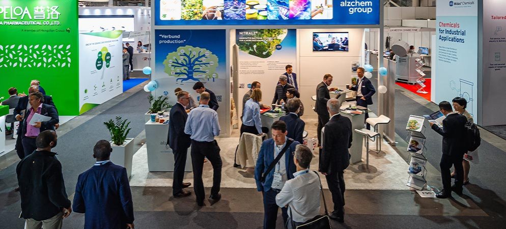 Exhibitors and visitors meet on an exhibit stand at Chemspec Europe