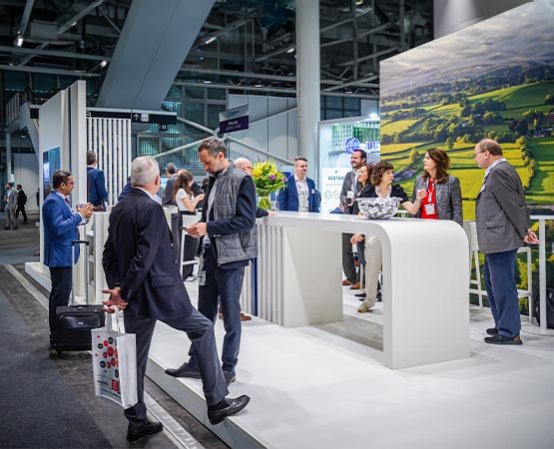 Exhibitors and visitors meet near an exhibit stand at Chemspec Europe